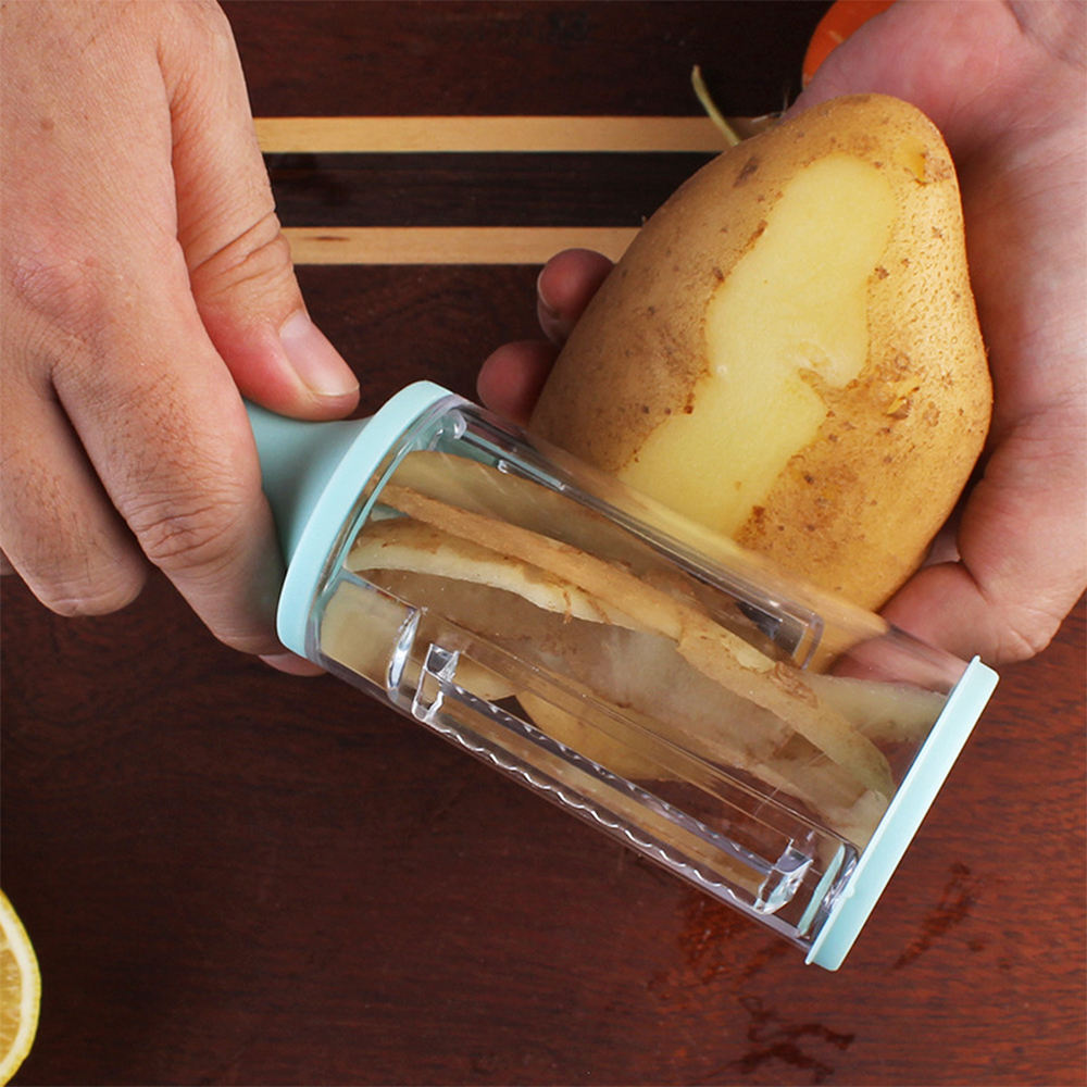 Vegetable pealer with storage box